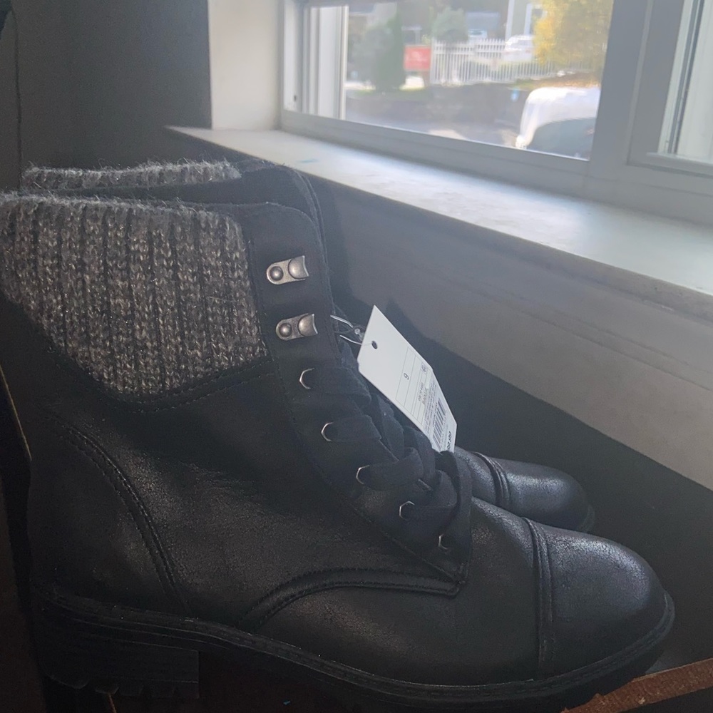 Cute black boots with gray trim.